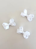 Tiny white overlay bow