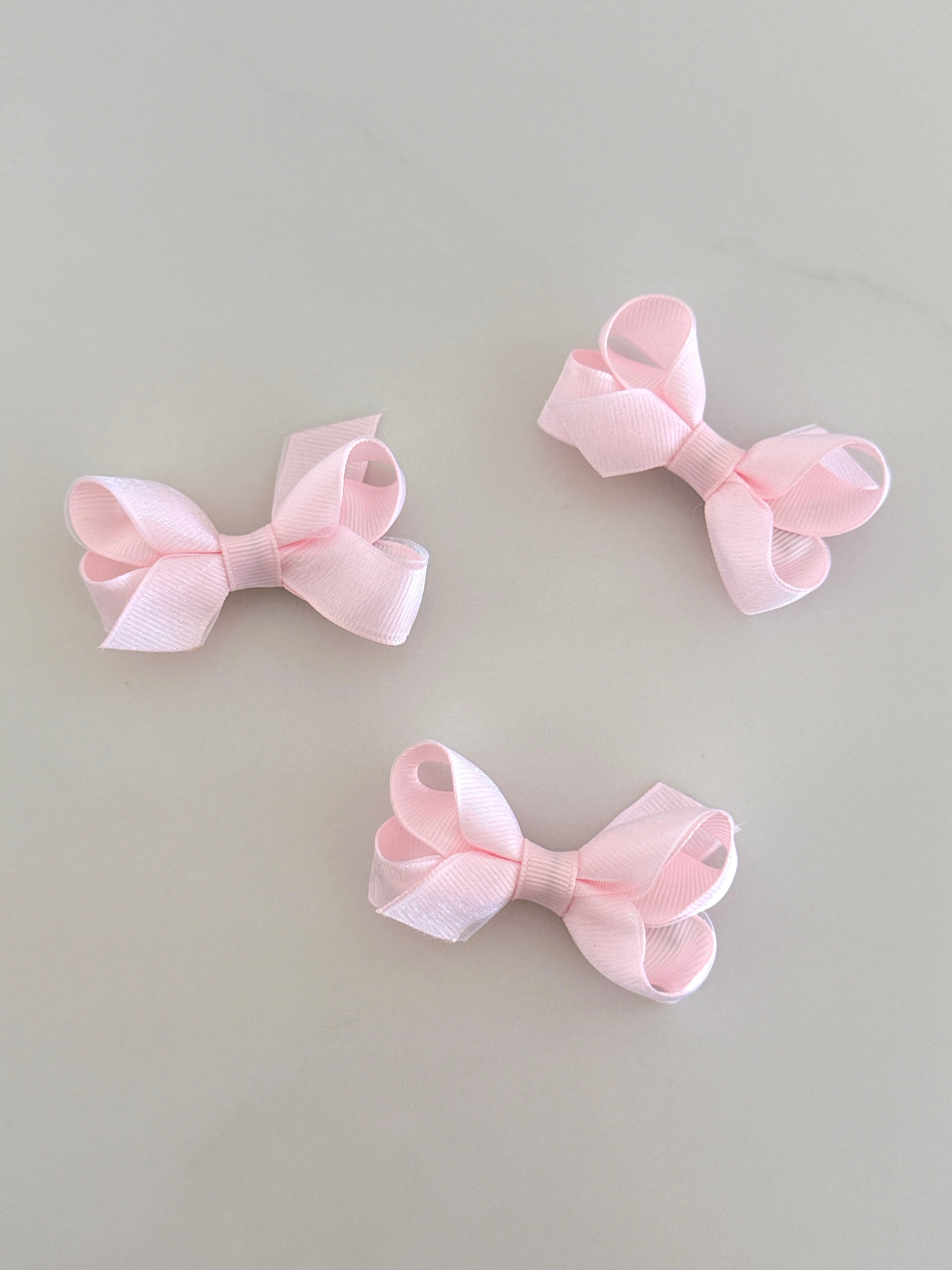 Tiny baby pink overlay bow