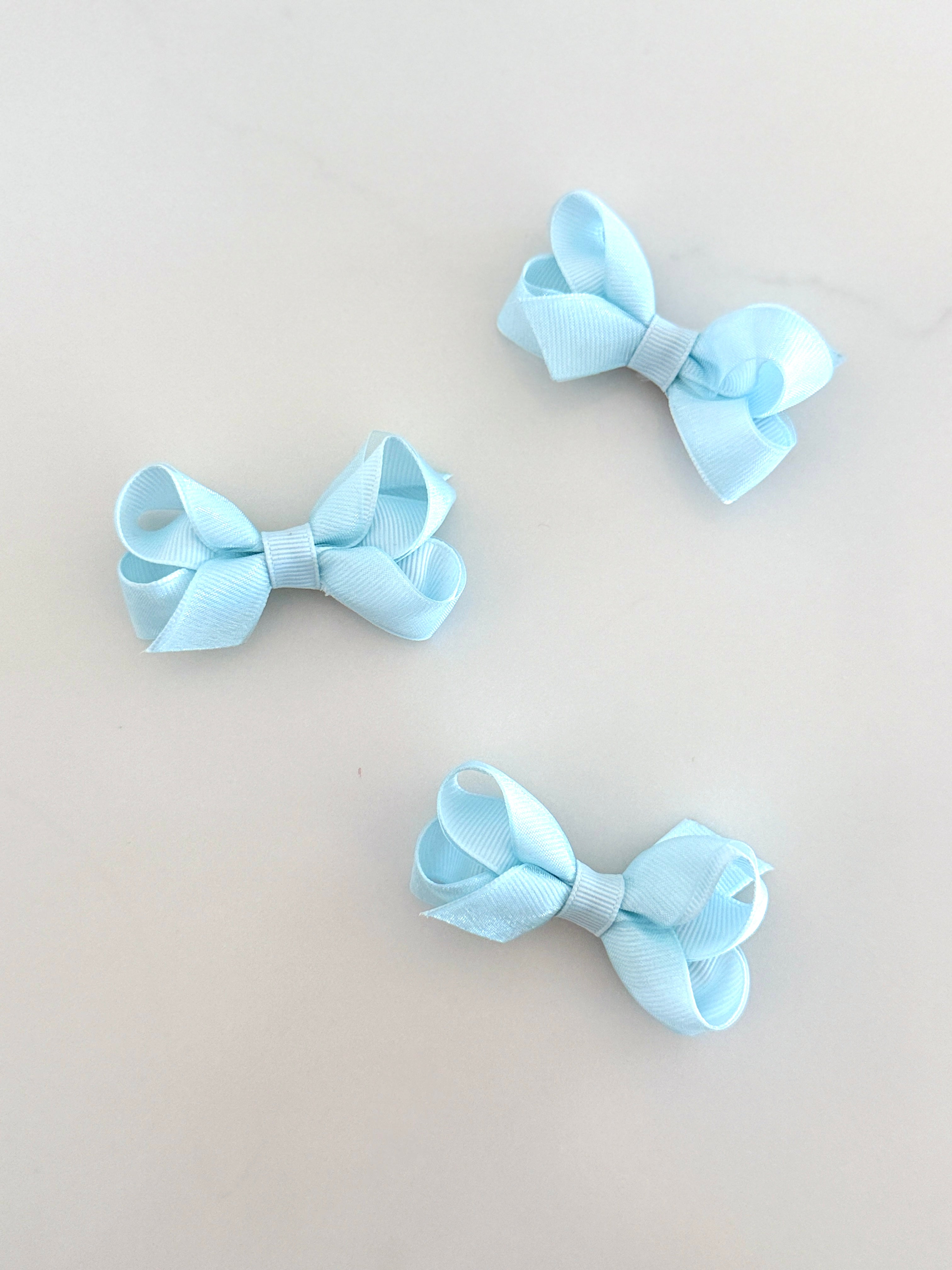 Tiny baby blue overlay bow