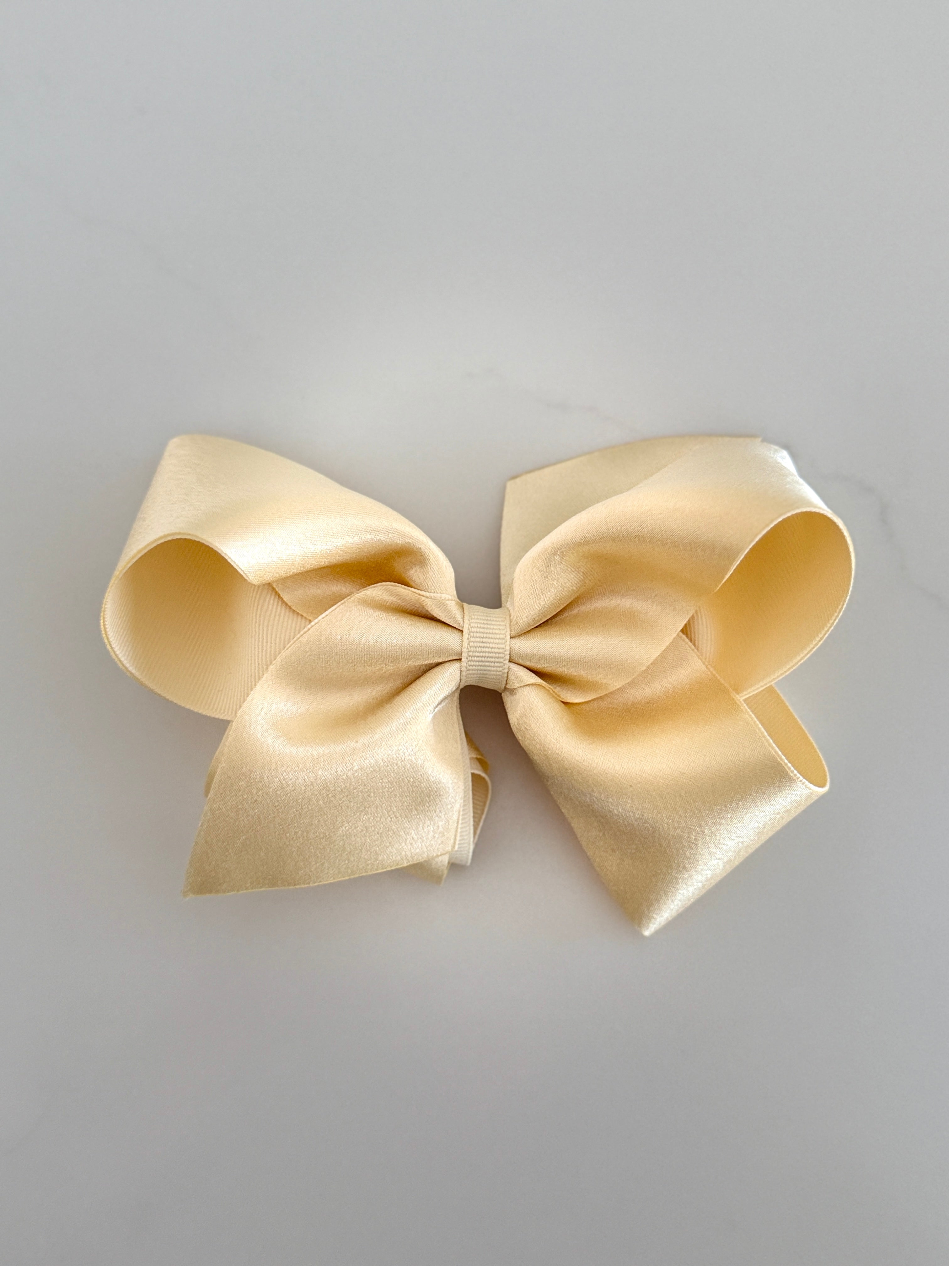KING gold satin overlay bow