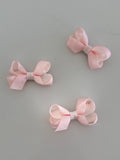 Tiny pink overlay bow