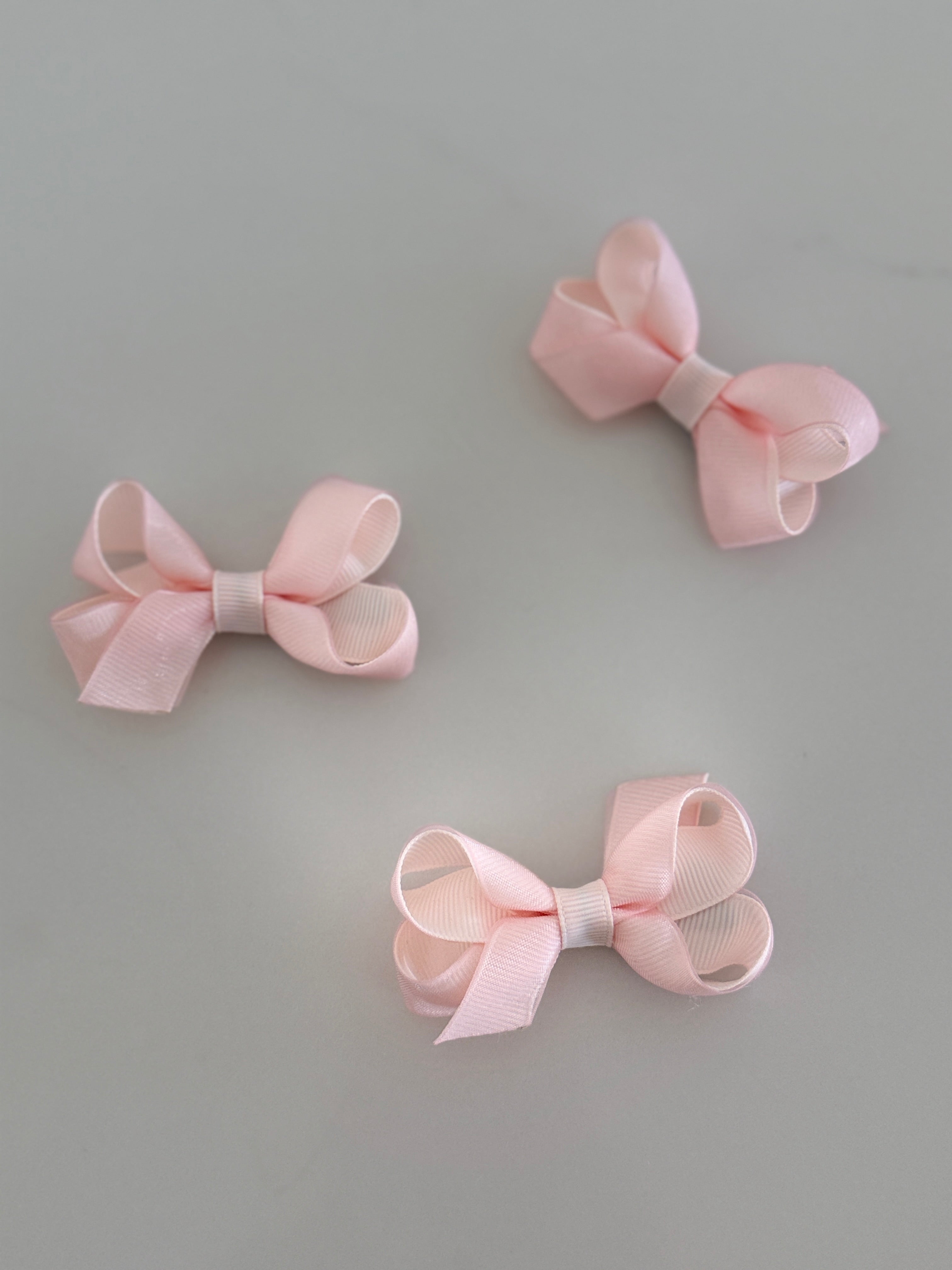 Tiny pink overlay bow